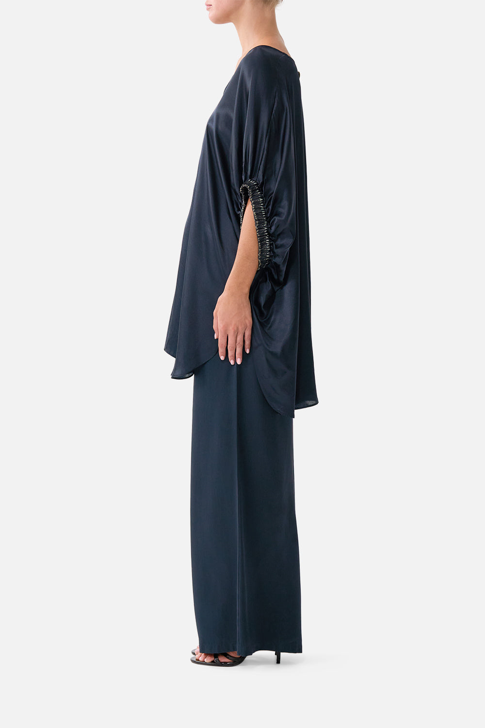 The CAMILLA GATHERED CUFF V NECK TOP DAUGHTERS OF DUENDE in our  print.