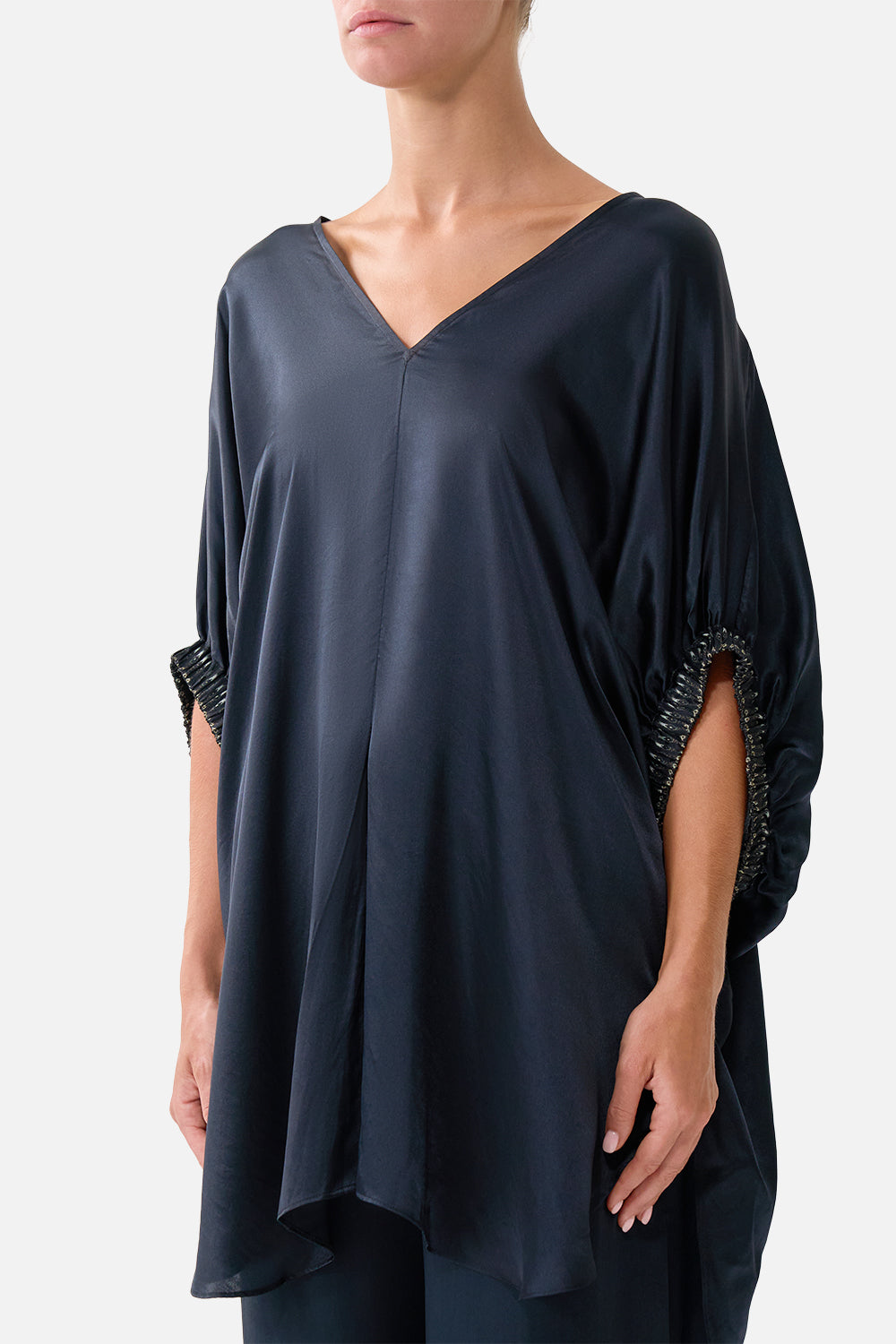 The CAMILLA GATHERED CUFF V NECK TOP DAUGHTERS OF DUENDE in our  print.