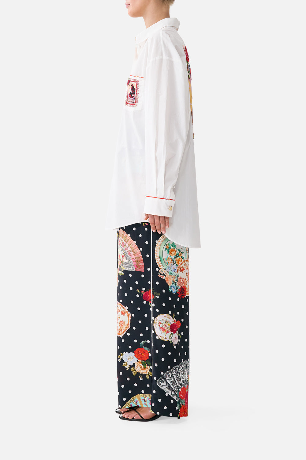 The CAMILLA long sleeve oversized shirt with pocket in our print Daughters of Duende. Side model view.