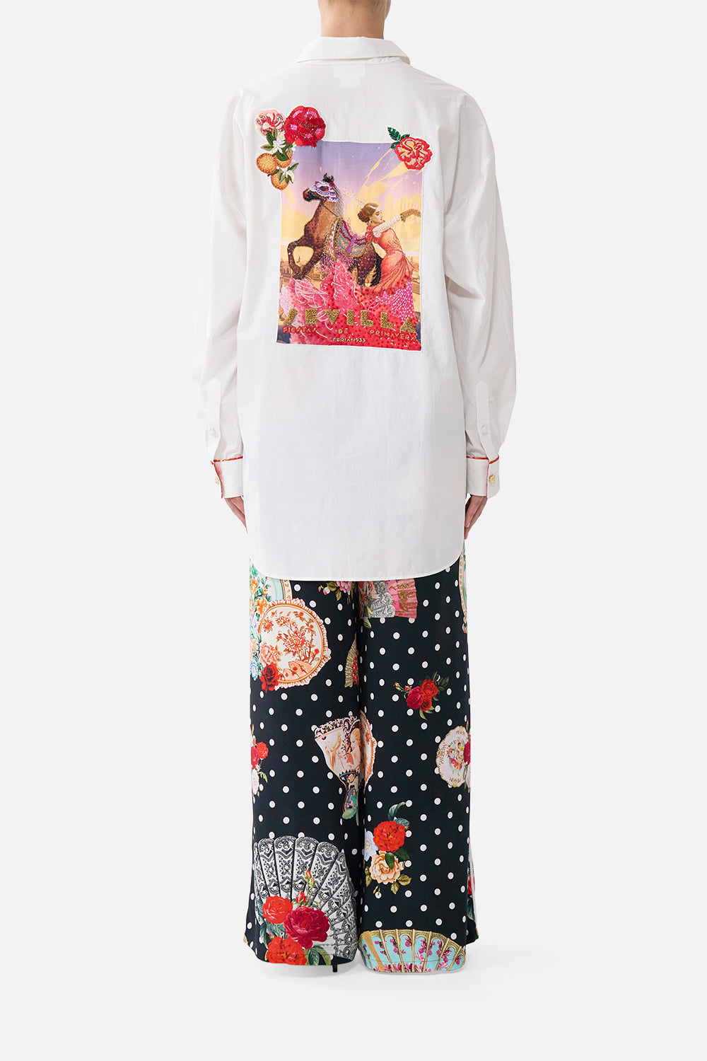 The CAMILLA long sleeve oversized shirt with pocket in our print Daughters of Duende. Back model view.