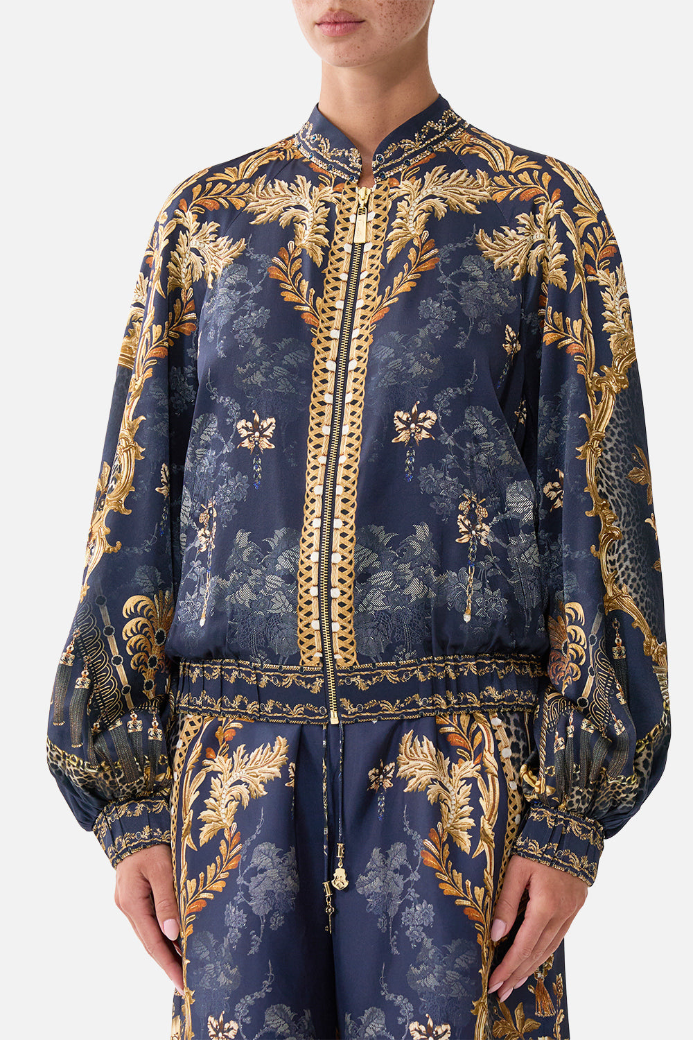 BOMBER JACKET WITH SHIRRED CUFF CLOAKED IN BAROQUE