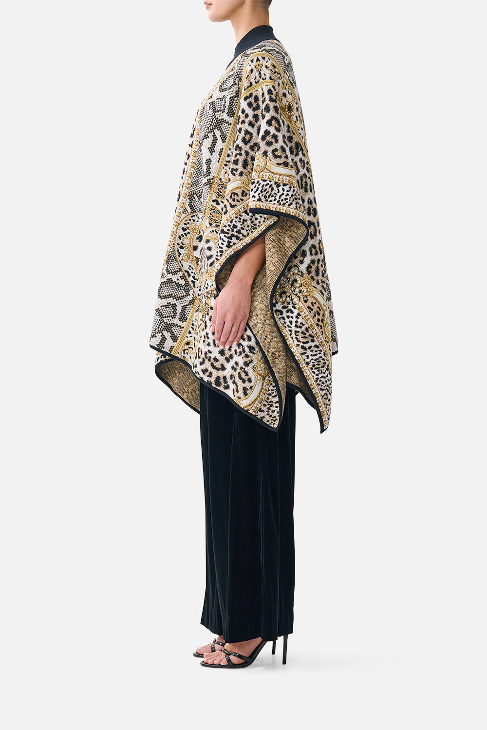 The CAMILLA Funnel Neck Drape Knit Poncho Leopard Libertine in our Leopard Libertine print.
